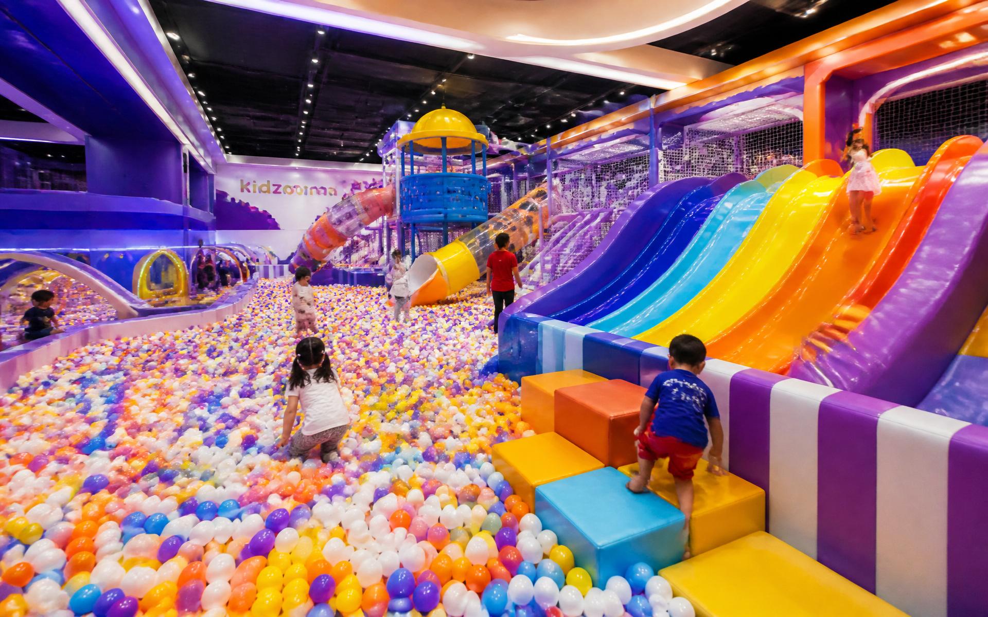 Premium indoor kids play zone with colorful ball pool and rainbow slides